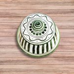 Handcrafted Moroccan tagine with green and white vertical stripes and traditional conical lid