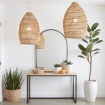 Dual 14" handwoven raffia lighting pendants displayed above modern console with mirror and plants