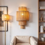 Raffia wall sconce mounted beside built-in shelving in neutral-toned living space
