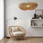 Handwoven rattan pendant lamp with lattice wave pattern above reading chair in minimalist living space