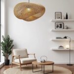Handwoven rattan pendant lamp with organic wave design in modern living room with floating shelves