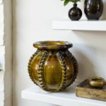 Handcrafted ceramic vase 30cm on white shelf featuring raised decorative ribs in rich olive green glaze finish