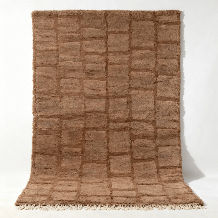 Brown Moroccan shag rug with geometric grid pattern Handwoven Moroccan wool rug with textured grid pattern in natural brown tones and fringe detail