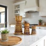Handmade ceramic candleholders set of 3 in golden glaze displayed on white kitchen island with modern decor
