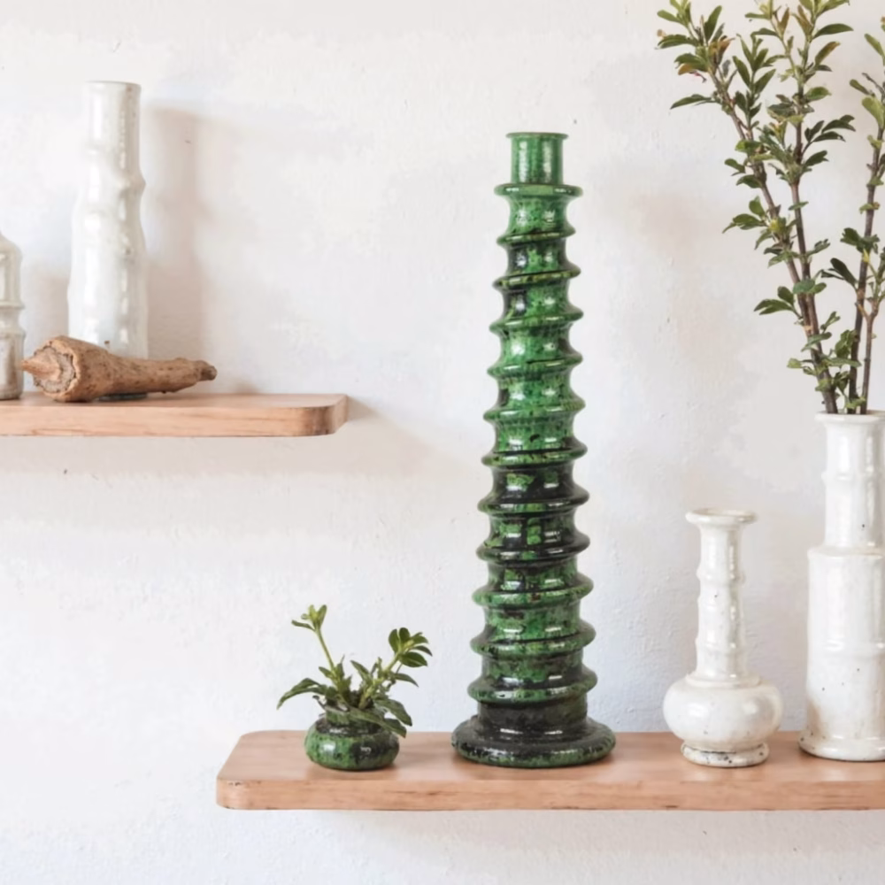 Emerald green ceramic candle holder with white accents