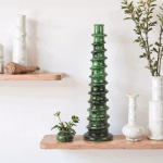 Emerald green ceramic candle holder with white accents