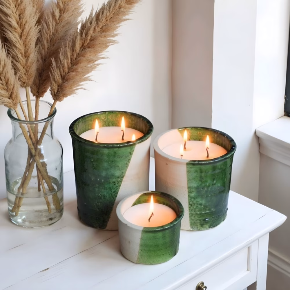 Green glazed ceramic candles with natural decor elements
