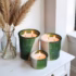 Green glazed ceramic candles with natural decor elements