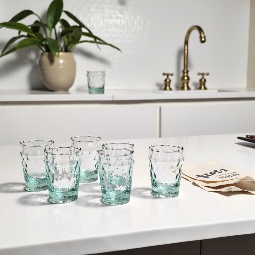 Handcrafted glasses of tea displayed in modern kitchen setting