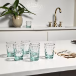 Handcrafted glasses of tea displayed in modern kitchen setting