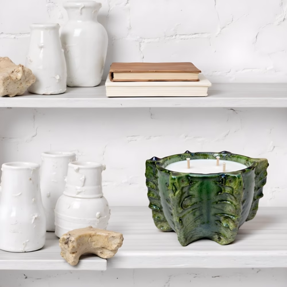 Handcrafted green ceramic candle with coastal decor