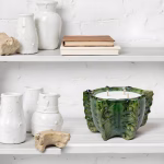 Handcrafted green ceramic candle with coastal decor