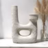 Handcrafted white pottery candle holder with minimalist design