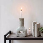 Handmade Tamegroute bottle candleholder with books and candle lit