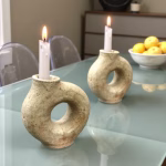 Handmade Tamegroute ceramic candleholders on glass dining table