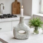 Artisan ceramic candle holder bottle in weathered gray, 14 inch handcrafted pottery on white surface