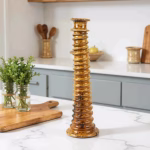Light brown tall candle holder in modern kitchen