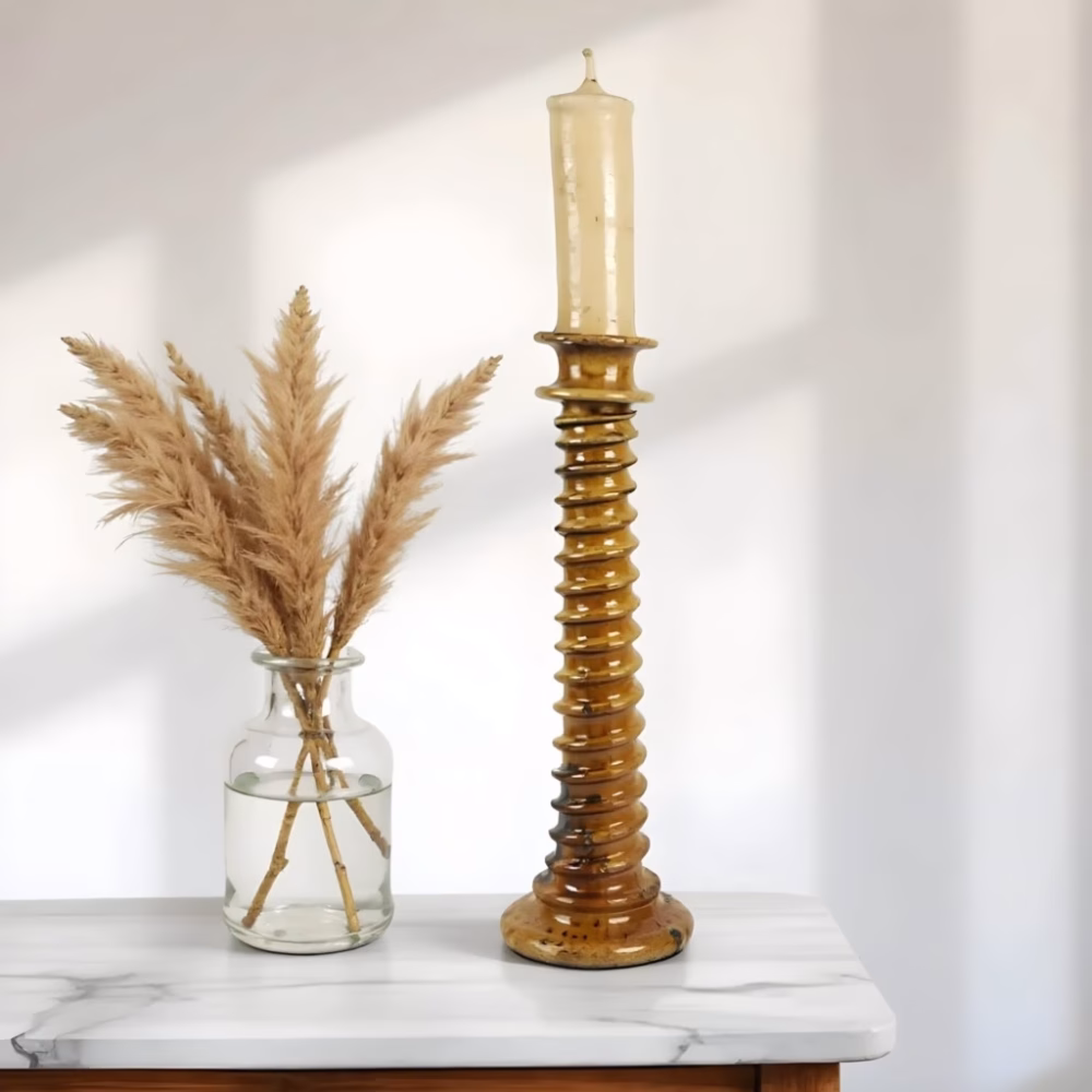 Light brown tall candle holder with natural decor