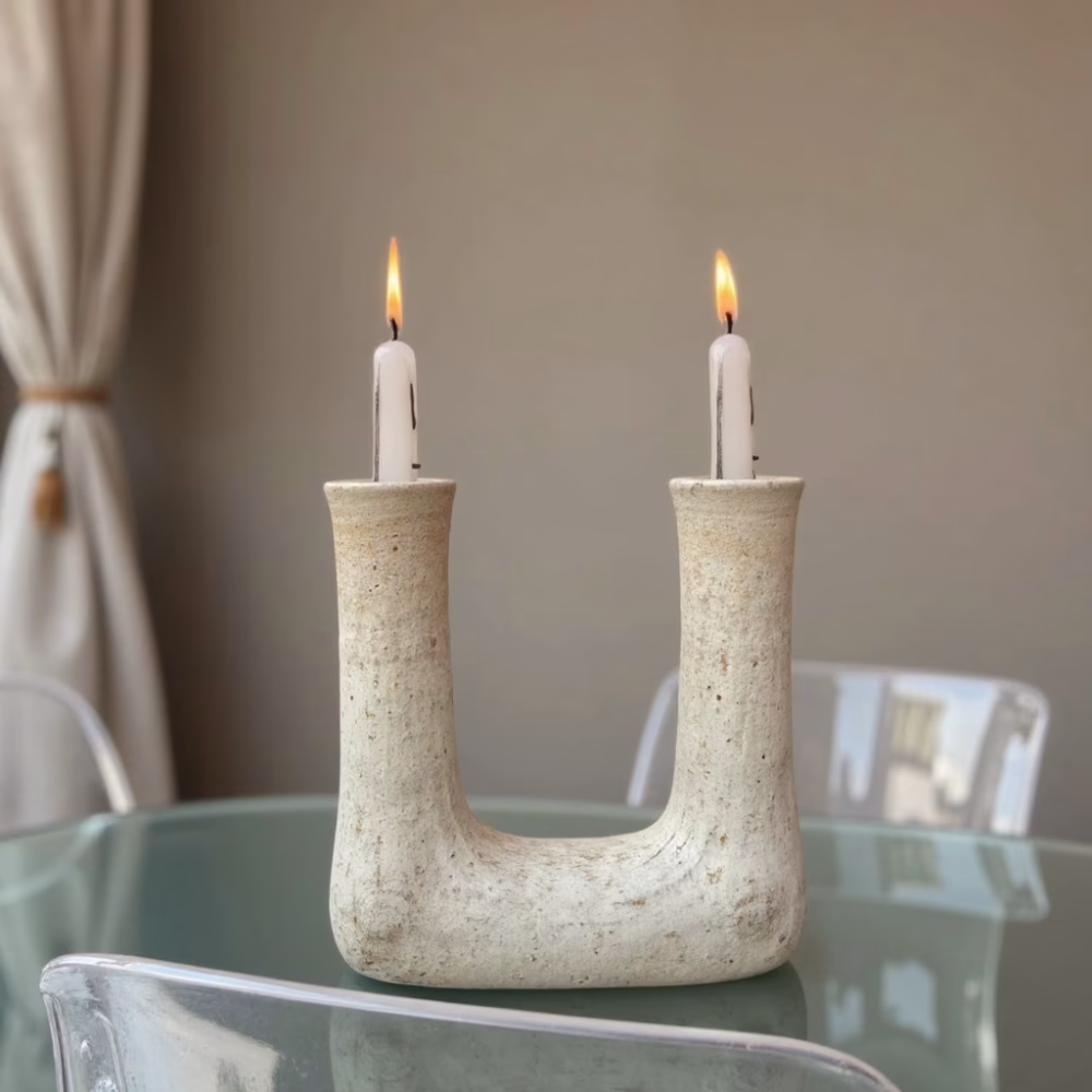 Minimalist Moroccan U-shaped candleholder with lit candles