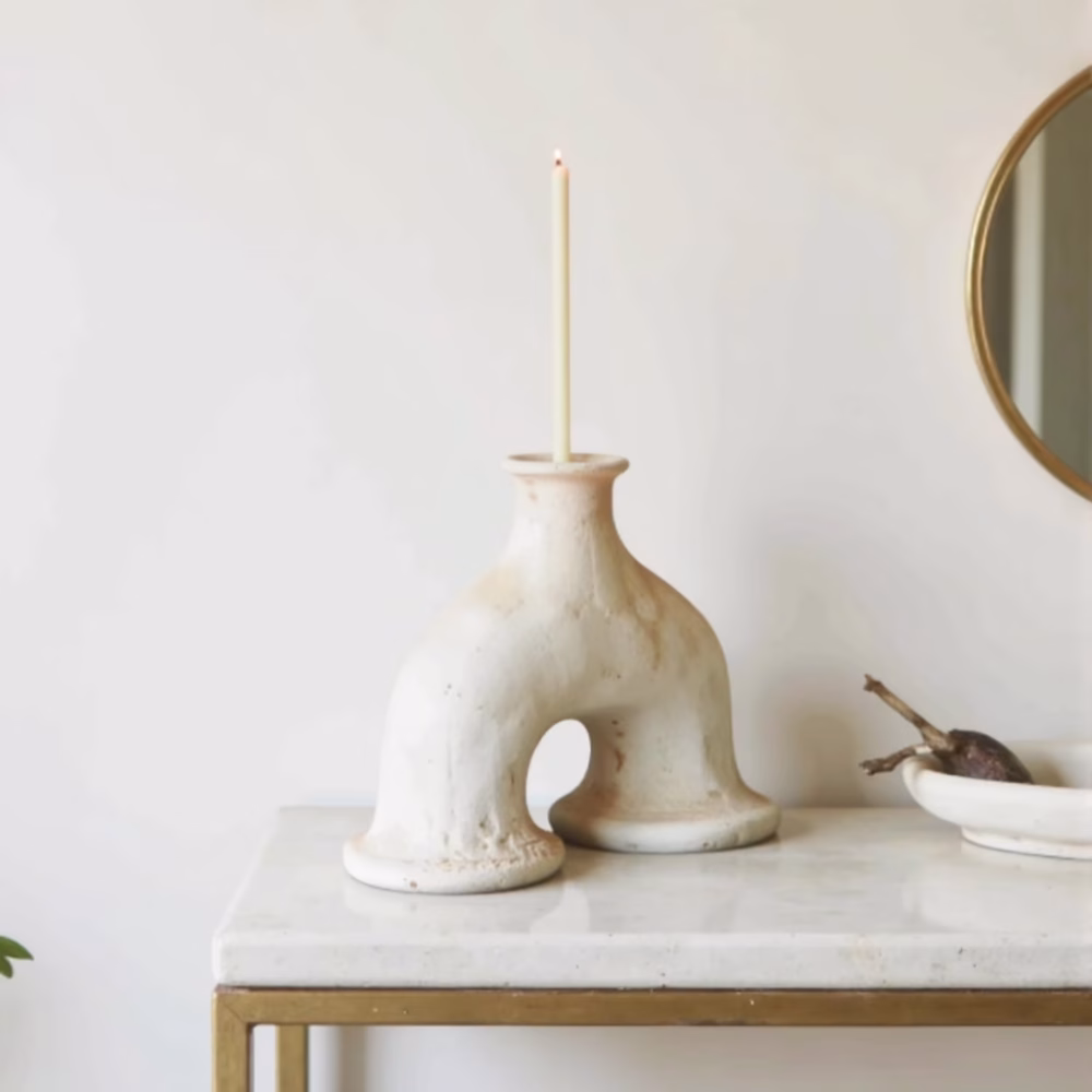 Modern white Moroccan ceramic arch candleholder on table