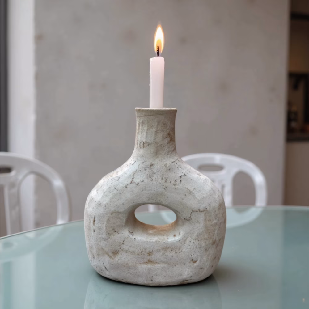 Moroccan bottle candleholder on turquoise dining table