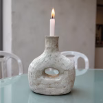 Moroccan bottle candleholder on turquoise dining table