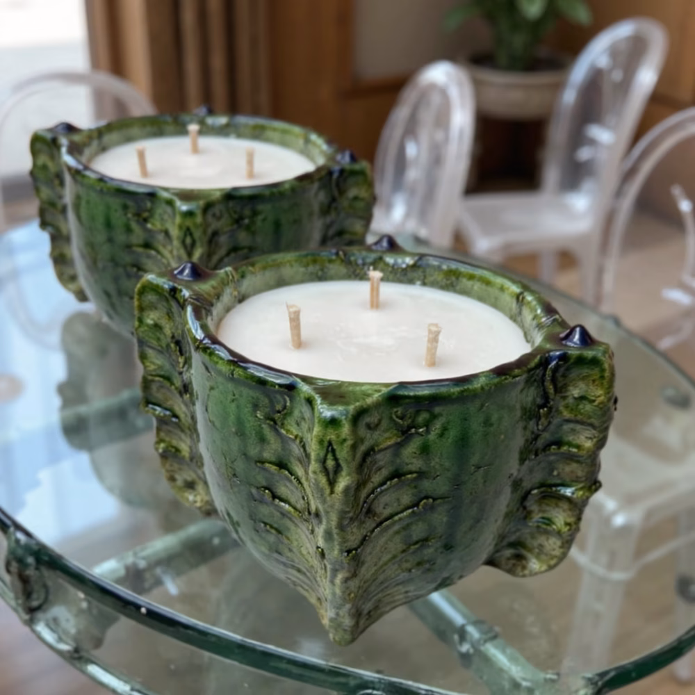Pair of Triple-wick candle in Tamegroute ceramic vessel on glass table