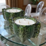 Pair of Triple-wick candle in Tamegroute ceramic vessel on glass table