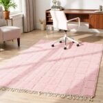 Rose Moroccan wool rug with checkerboard pattern in modern kitchen with concrete floors and greenery