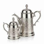 Moroccan silver coffee server set of two sizes with hand-engraved Islamic geometric patterns on white background
