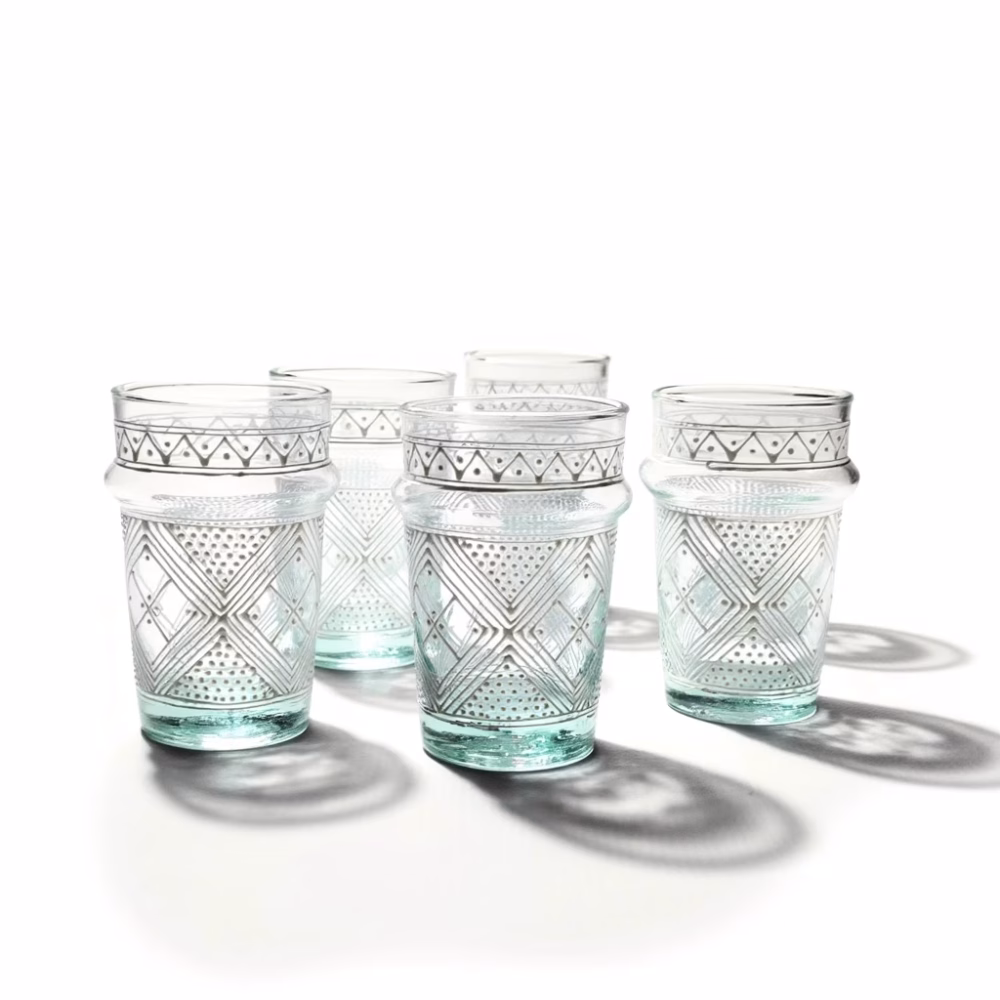 Six-piece hand-painted tea glass set showcasing white patterns