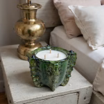 Tamegroute ceramic candle bowl next to brass decor