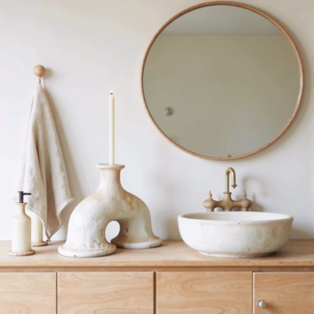 Tamegroute pottery arch candleholder styled in modern bathroom