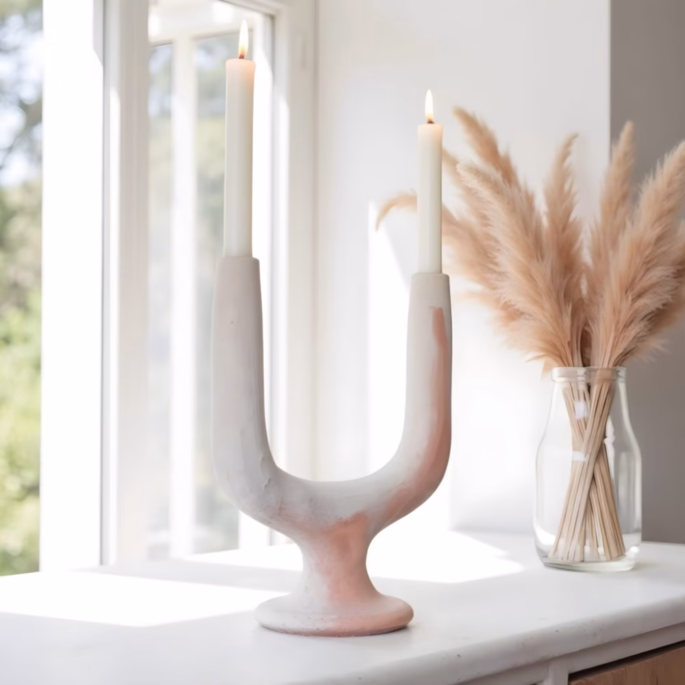 Unglazed white Twin Arc Candlestick Holder in window setting