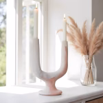 Unglazed white Twin Arc Candlestick Holder in window setting
