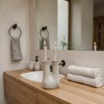 U-shaped ceramic double candleholder on bathroom vanity with lit candles, handcrafted pottery home accent
