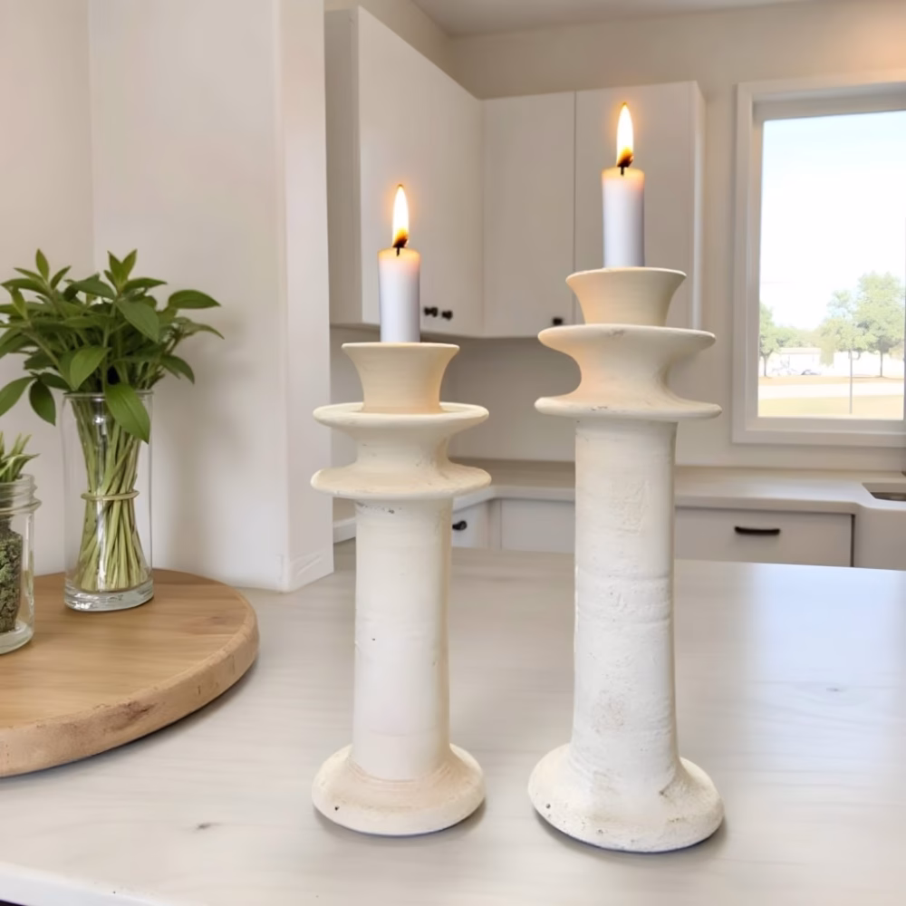 White Tamegroute pottery candleholders with lit candles