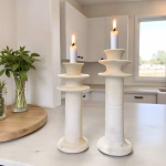 White Tamegroute pottery candleholders with lit candles