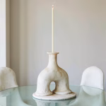 White ceramic arch candleholder in bathroom setting
