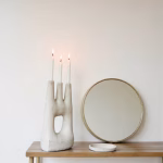 White triple candle holder with round mirror decor