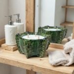 Handcrafted ceramic candle 10 inch bowl in emerald glaze with wooden wicks on bathroom shelf