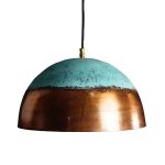 Hand-hammered brass pendant light with verdigris patina top and polished copper dome on white background