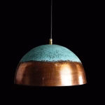 Dramatic night shot of copper and verdigris dome lamp