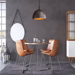 Hammered dome light in industrial dining setting