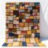 Patchwork color block rug handwoven with vibrant multicolor wool squares separated by black lines and fringe edges