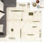 Moroccan Berber rug overhead view handwoven wool with olive geometric patterns cream base and fringe