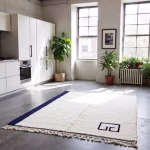 Modern Moroccan minimalist rug with navy border in contemporary kitchen