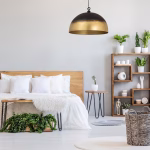 Modern brass dome pendant light in contemporary bedroom setting