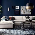 Modern living room featuring brass globe pendant light