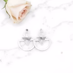 Silver triangle hoop earrings with rose on marble